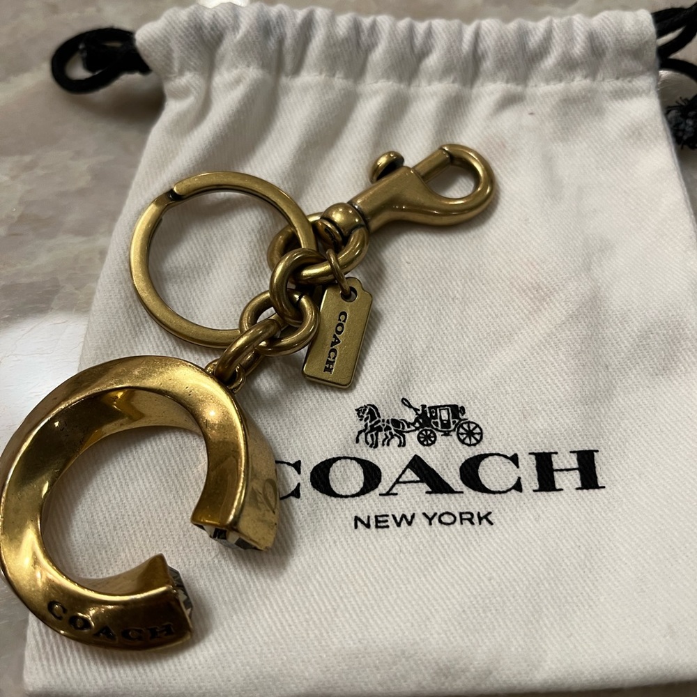 Coach purse charm. Heavy bronze with clear end crystals. BAG NOT INCLUDED